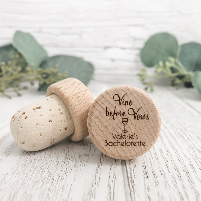 Personalized wine bottle stopper made from 100 percent real cork with an engraved wooden top with the words Vino before vows, a wine glass and the brides bachelorette info. Perfect for wedding favors, bachelorette favors and wedding shower gifts.