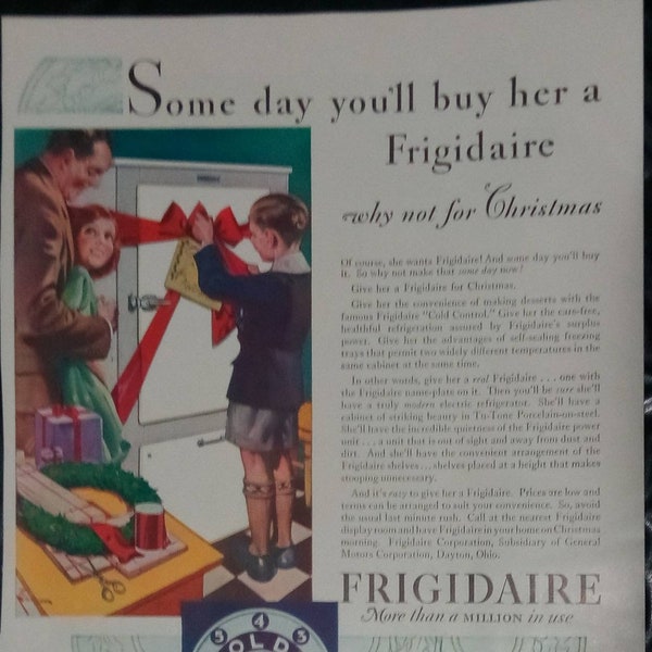 1920's Vintage Frigidaire Refrigerator Ad - Husband buys wife a fridge for Christmas.  1920s family life, kitchen scene.