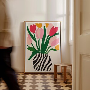 Bright floral poster with red, pink, and yellow tulips in striped vase
