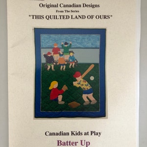 May include: A quilt pattern for a single quilt titled "Batter Up" from the series "This Quilted Land of Ours" by Sugar Maple Productions. The pattern features a baseball scene with children playing on a blue and white baseball field.