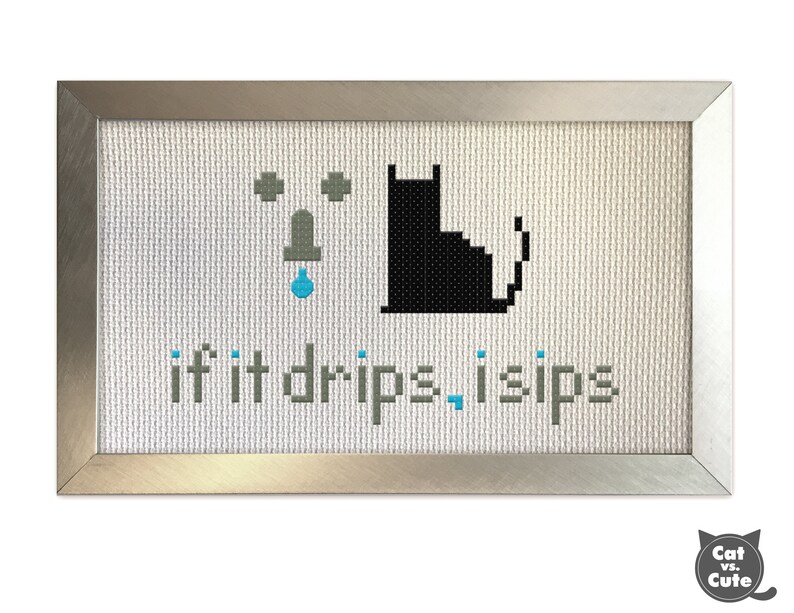 May include: A framed cross-stitch design with a black cat and a dripping faucet. The text reads "if it drips, I sips".
