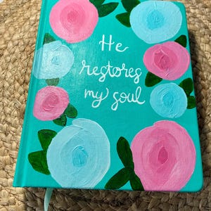 He Restores Hand-Painted Bible