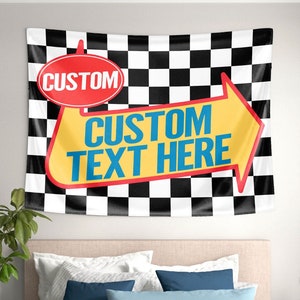 May include: A black and white checkered tapestry with a yellow arrow pointing to the right. The arrow has the text "CUSTOM TEXT HERE" in blue letters and a red circle with the text "CUSTOM" in white letters.