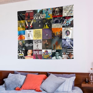 May include: A tapestry featuring a collage of album covers from various popular music artists, including Eminem, Pearl Jam, My Chemical Romance, and Dr. Dre. The tapestry is made of a soft, woven fabric and is perfect for adding a touch of personality to any room.