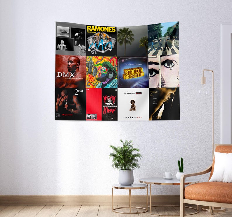 May include: A tapestry featuring album covers from various artists, including DMX, 2Pac, Ramones, and The Beatles. The tapestry is a collage of different album covers, each with its own unique design and color scheme.