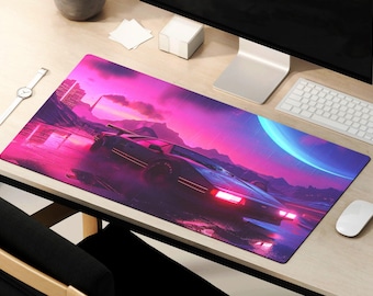 May include: A pink and purple gaming mouse pad with a retro futuristic design featuring a black sports car driving through a neon landscape. The mouse pad has a smooth surface and is designed for use with a computer mouse.