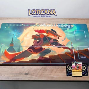 May include: A colourful game board featuring a fox character in the centre. The board has a blue and white background with a light brown wooden texture. The board has a deck and discard area. The game is called "Lorcana Trading Card Game".