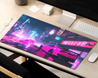 May include: A pink and purple mousepad with a neon cityscape and two pink sports cars. The mousepad has Japanese text that reads "Shinjuku" and "Tokyo".