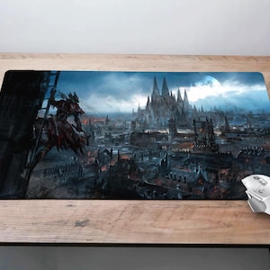 May include: A dark fantasy themed mouse mat featuring a city skyline with a large cathedral in the background. A figure on horseback rides up a ladder in the foreground. The mouse mat is designed for use with a computer mouse.