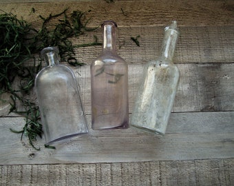 Old Bottles Set of Three Bottles Cloudy Stained Light Purple Violet Glass