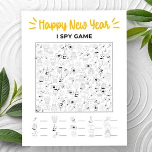 May include: A white paper with the text "Happy New Year I Spy Game" in yellow. The game features a black and white illustration with various New Year's themed objects. The bottom of the page has spaces for answers.
