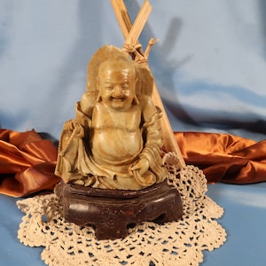 SITTING LAUGHING BUDDHA, Jolly Laughing Buddha,Sitting Buddha from China made of Sandstone,from China,Black colored 8 inch laughing Buddha