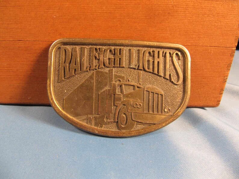 mens vintage collectable memorabilia Truckers Belt buckle of solid brass RALEIGH LIGHTS BELT Buckle Solid Brass Belt buckle Raliegh Lights