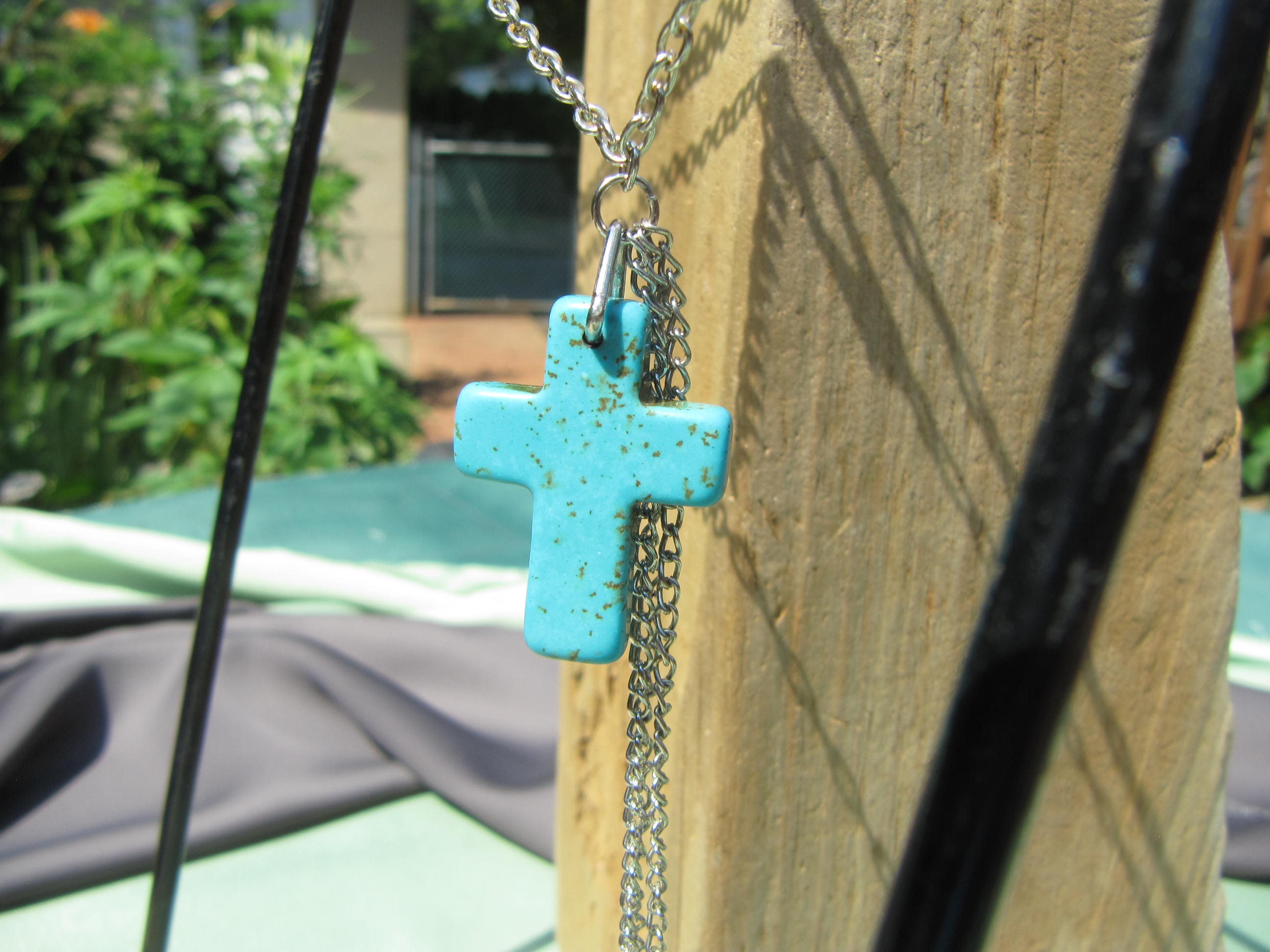 TURQUOISE CROSS and CHARMS on Silver Tone Chain, One in TURQUOISE CROSS and CHARMS on Silver Tone Chain, One in