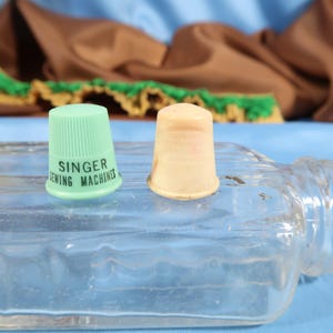 VINTAGE THIMBLE PAIR, Singer Sewing machines ad promo thimble and bakelite thimble Antique Plastic Thimbles Sewing accessories by Singer