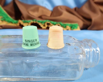 VINTAGE THIMBLE PAIR, Singer Sewing machines ad promo thimble and bakelite thimble Antique Plastic Thimbles Sewing accessories by Singer
