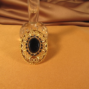 VICTORIAN REPRODUCTION PIN, Black stone in gold colored setting with Filigree like setting, Black and gold colored glass rhinestone brooch
