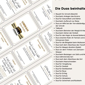 May include: A white card with gold trim and Arabic text. The card has a graphic of the Kaaba, a cube-shaped building in Mecca, Saudi Arabia. The card is titled "Umrah Dua-Haftler". The text on the card reads "Die Duas beinhalten" and lists a series of prayers in Arabic and German.