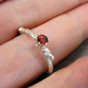 budding twig sterling silver ring with red diamond cut garnet. Contemporary engagement ring.