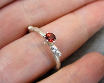 budding twig sterling silver ring with red diamond cut garnet. Contemporary engagement ring.