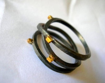 oxidized sterling silver infinity ring with gold plated square dots. Triplet ring