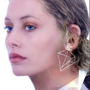 Sterling silver diamond shape geometric earrings.