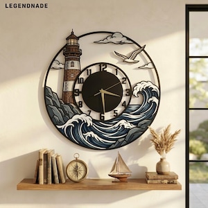 May include: A circular wall clock featuring a lighthouse, crashing ocean waves, and a flying seagull. The clock face is black with gold hands and numbers. The text LEGENDNADE is visible in the top left corner of the image.