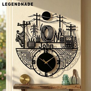 May include: A black wall clock featuring a laser-cut design of an electrical lineman working on a utility pole, power lines, a transformer, a coil of wire, tools, and a multimeter. The name John is centered above a circuit board pattern clock face.