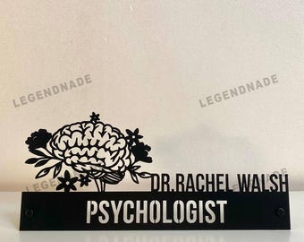 May include: Black metal desk sign with the text "DR. RACHEL WALSH PSYCHOLOGIST". The sign features a decorative brain and floral design. The brand name "LEGENDNADE" is visible in the top left corner.