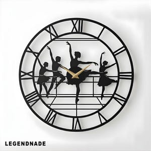 May include: Black metal wall clock featuring a silhouette of four ballerinas in various dance poses. The clock has a Roman numeral dial and gold-colored hands. The word "LEGENDNADE" is printed at the bottom.