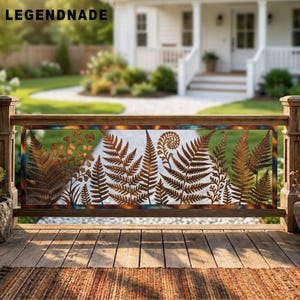 May include: A rectangular metal railing panel featuring a laser-cut design of various fern leaves and foliage. The metal has a weathered, rusted brown finish with hints of blue and copper oxidation along the edges. The text LEGENDNADE is visible.