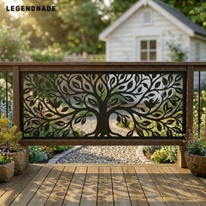 May include: A black metal privacy screen featuring a laser-cut design of a tree with spreading branches, leaves, and two birds perched on opposite sides. The rectangular panel is mounted within a wooden railing frame with the text LEGENDNADE.