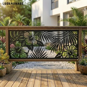 May include: A black metal privacy screen featuring a laser-cut design of tropical hibiscus flowers and palm leaves. The rectangular panel is mounted within a wooden frame, displaying intricate botanical silhouettes against a blurred outdoor background.