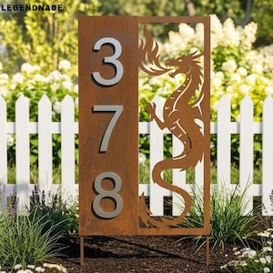 May include: A metal address sign with the numbers 378 in silver. The sign has a rectangular panel with a dragon silhouette on the right side. The sign is made of rusted metal and is placed in a garden.