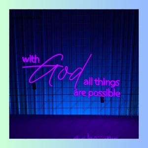 May include: Purple neon sign with the text "with God all things are possible" on a blue grid background.