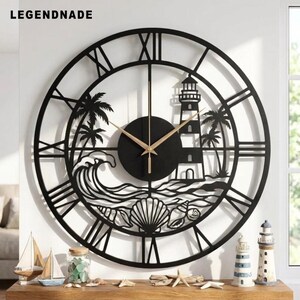 May include: A large circular wall clock featuring a black metal frame with Roman numerals. The center design depicts a lighthouse, palm trees, ocean waves, and seashells. The clock has two thin gold-colored hands centered on a black circular dial.