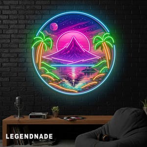 May include: A circular neon sign depicting a tropical scene with a mountain, palm trees, and a sunset over water. The sign has a blue neon border and the word "LEGENDNADE" at the bottom.
