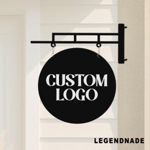 May include: A black, circular sign displaying "CUSTOM LOGO" in white text, suspended from a black metal bracket. The sign is designed for custom branding. The word "LEGENDNADE" is printed in white at the bottom.