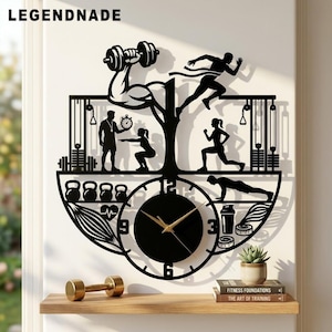May include: A black wall clock featuring a fitness-themed cutout design with silhouettes of people lifting weights, running, and performing exercises. The clock face has gold hands and numbers 3, 6, 9, and 12. The text LEGENDNADE appears at the top.