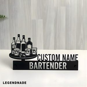 May include: Black metal bartender sign with a custom name option. The sign features a silhouette of liquor bottles, glasses with ice cubes, and the word "BARTENDER". The brand name "LEGENDNADE" is at the bottom.