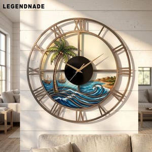 May include: A large round wall clock with a bronze-coloured metal frame featuring Roman numerals. The centre displays a painted coastal scene with a palm tree, blue ocean waves, and two sailboats. A black circular dial holds thin gold clock hands.