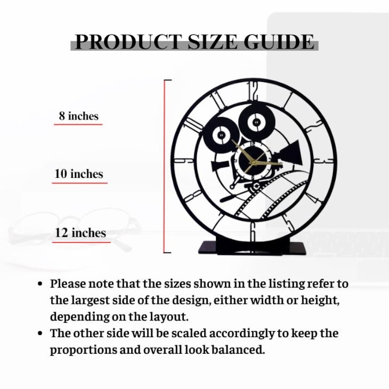 May include: Black metal clock with a film camera design. The clock face features Roman numerals and gold-colored clock hands. The image includes a product size guide with dimensions of 20, 25, and 30 cm. The text reads "PRODUCT SIZE GUIDE".