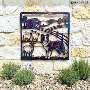 May include: A square metal wall art piece depicting a farm scene with a barn, sheep, and a Border Collie dog. The artwork has a rustic, multi-colored finish and is mounted on a stone wall. The word "LEGENDNADE" is in the upper right corner.