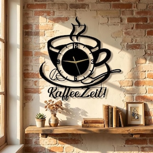 May include: A black wall clock shaped like a coffee cup on a saucer with steam rising, featuring gold hands and the text "KaffeeZeit!" in a script font. The clock face includes numbers 3, 6, 9, and 12, with a spoon and coffee beans depicted.