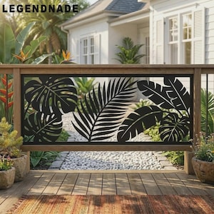 May include: A black metal railing panel featuring a laser-cut design of various tropical leaves, including monstera and palm fronds. The rectangular panel is framed by a wooden structure and displays the text LEGENDNADE in the top left corner.
