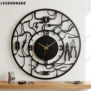 May include: A black circular wall clock featuring a central dial with gold hands and numbers 3, 6, 9, and 12. The frame is a complex cutout design of electrical wires, plugs, switches, and pliers. The text LEGENDNADE is visible in the top left corner.