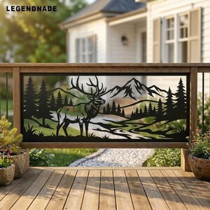 May include: A black metal railing panel featuring a laser-cut silhouette of an elk standing in a forest landscape with mountains in the background. The design includes pine trees and a winding path. The text LEGENDNADE is visible in the top left.