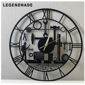 May include: Black metal wall clock with a mechanic theme. The clock features Roman numerals, gears, wrenches, a hammer, and a mechanic figure. The clock hands are gold. The word "LEGENDNADE" is at the top.