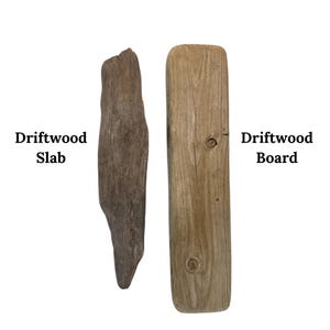 May include: Two pieces of driftwood, a slab and a board, are displayed against a white background. The driftwood slab is a dark brown color and has a rough, irregular shape. The driftwood board is a light tan color and has a rectangular shape. Text on the left reads "Driftwood Slab" and on the right "Driftwood Board".