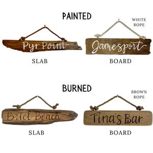 May include: Four wooden signs with rope hangers. Two are labeled "Painted" and two are "Burned." The signs read "Pyr Point" and "Jamesport" with white text, and "Briel Beach" and "Tina's Bar" with brown text.